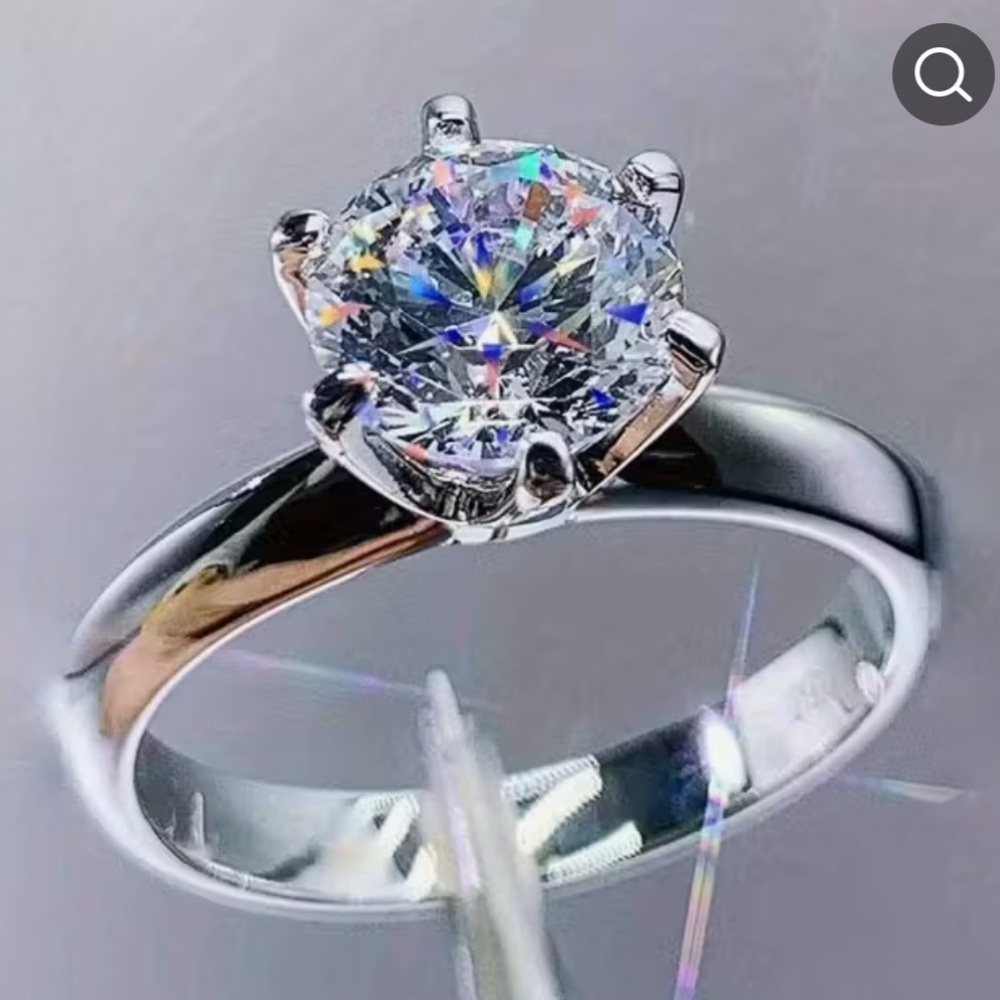 Elegant Silver Ring with beautiful 3 ct Moissanite stone.